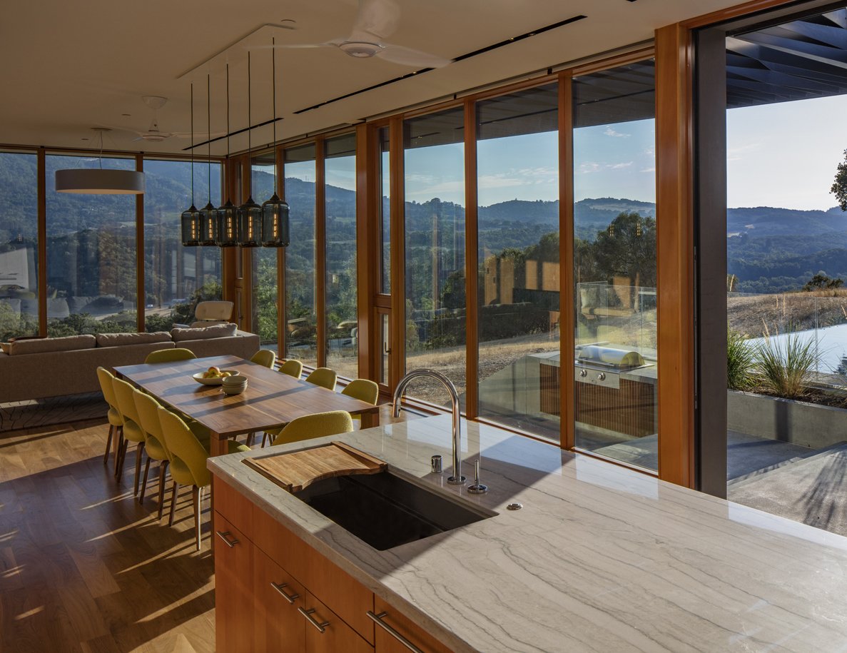 Are you hanging multiple modern pendant lights like in this space? The Linear-5 Modern Chandelier offers an efficient way to combine any five light fixtures with a single electrical junction box. The glass color, pendant shape, cord length, and metal finish are up to the client, making each lighting installation truly unique and suitable for any design style.