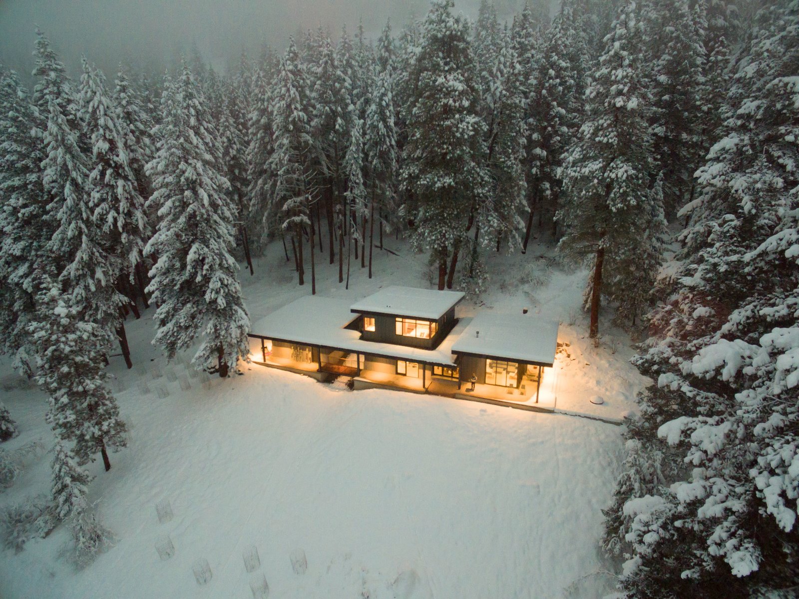 Exterior, House Building Type, Metal Roof Material, Metal Siding Material, Shed RoofLine, and Cabin Building Type This cabin has a commodious kitchen and living area that encourages family and friends to come together for meals and conversation.