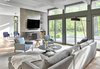 Modern home with Living Room, Light Hardwood Floor, Chair, Wood Burning Fireplace, Coffee Tables, Sofa, and Bookcase. Family Room Photo 4 of Riverwoods