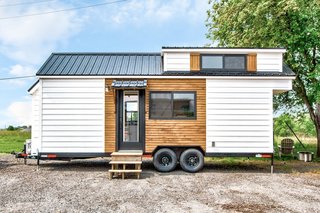 The Rumspringa is clad with wood siding and a galvanized metal roof.