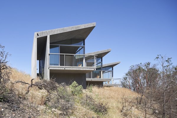 The 840-square-foot guesthouse Mork Ulnes Architects designed in Sonoma, California, comprises three concrete-and-glass volumes that line a great ridge.