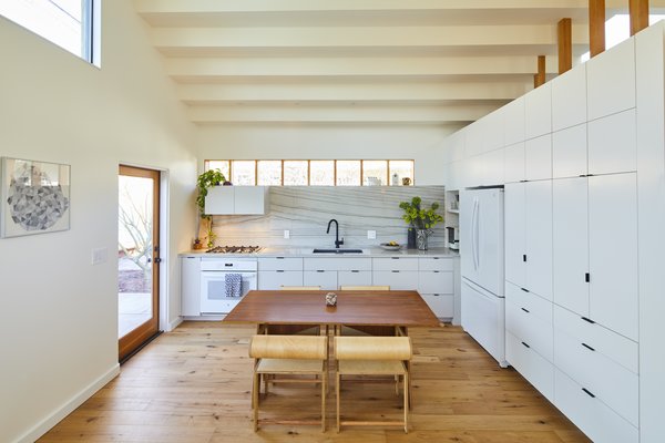 The dining table was crafted from a single 4x8 sheet of walnut. The chairs, designed by Shin Okuda, are from Waka Waka in Los Angeles.