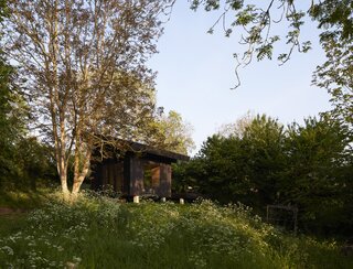 With its emphasis on the outdoors, the petite shelter in Normandy offers room to roam.