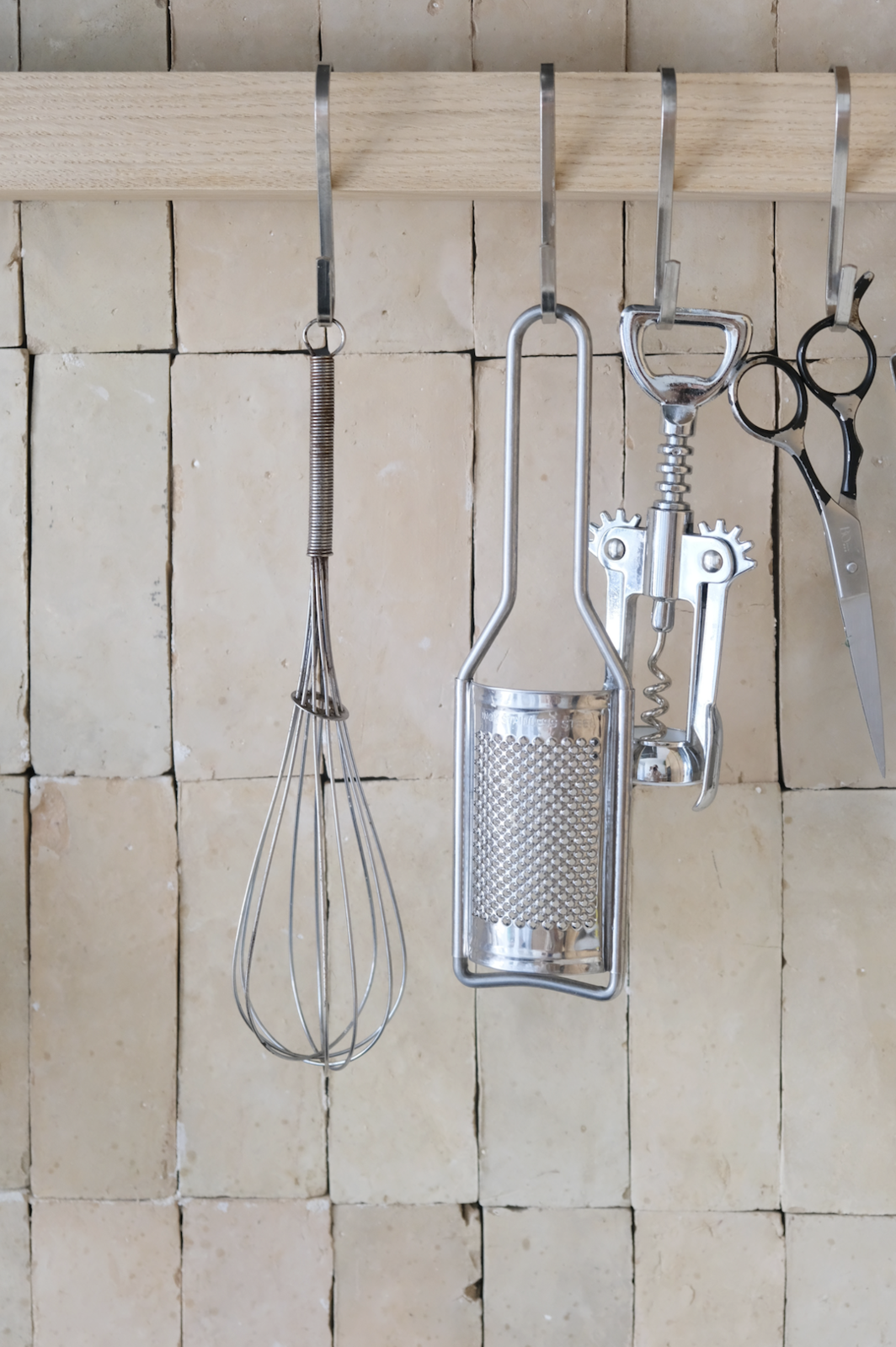 The Morrocan tile backsplash in the kitchen lends more natural texture and a light, soothing tone.