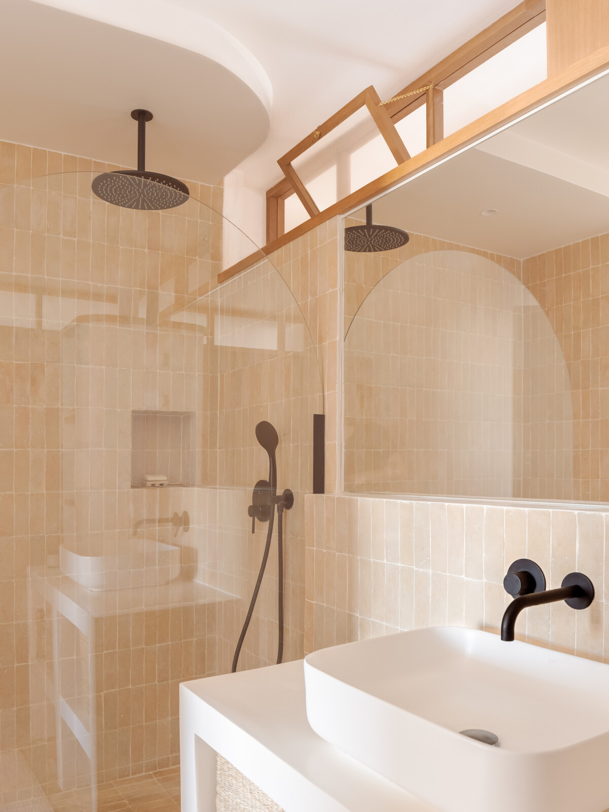 Portuguese ceramic tile with a matte finish lends texture in one of the bathrooms.