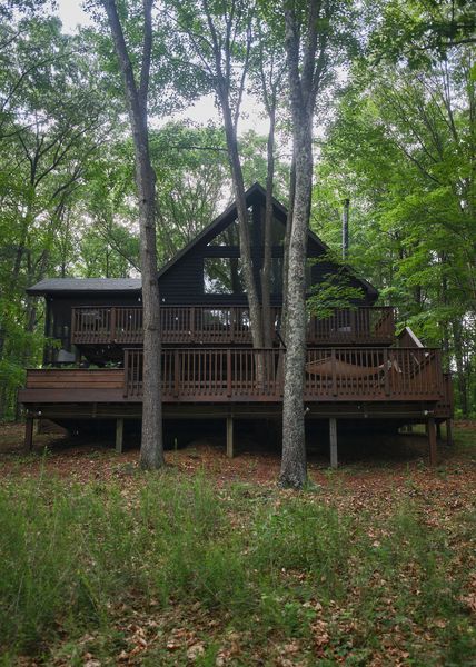 Julie and Malcom repaired and refinished the cabin's expansive pine decks, which offer places to sit and watch the seasons change.