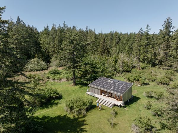 Solar photovoltaic panels on the cabin's shed-style roof produce hot water and electricity for the cabin, named Sol Shed in honor of its main energy source.