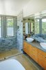 The master shower features views across the creek to the ridge beyond. Photo 12 of Healdsburg Family House modern home