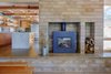 Radiant-heat in the concrete floors, along with the Watershed Block hearth and wood stove provide a boost of heat on cool, cloudy days. Photo 4 of Healdsburg Family House modern home