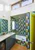 Playful upstairs bathroom with recycled glass Vetrazzo countertop. © www.edwardcaldwellphoto.com Photo 7 of Santa Cruz Strawbale modern home