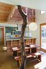 The spacious, naturally ventilated 2-story dining space is accentuated with the natural branching of a madrone tree. © www.edwardcaldwellphoto.com Photo 4 of Santa Cruz Strawbale modern home