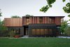Modern home with Exterior, House Building Type, Metal Siding Material, Wood Siding Material, and Flat RoofLine. Sustainable elements of the home include a geothermal heat pump HVAC system, energy efficient windows and sprayed foam insulation. The exterior wood is a vertical shiplap siding milled from FSC certified Machiche. BauLinder Haus was designed to meet and exceed requirements put forward by the U.S. Environmental Protection Agency for their Indoor airPLUS qualified homes, and is working toward Energy Star qualification.
#sustainable #courtyard #wood #kansascity #baulinderhaus #hufft
Photo credit by Mike Sinclair Photo 3 of BauLinder Haus