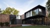 Modern home with Exterior, House Building Type, Wood Siding Material, Flat RoofLine, and Metal Siding Material. The house’s simple form was conceptualized as a series of stacked boxes, with public spaces residing on the ground level and private spaces in the boxes above. In plan, the boxes are oriented in a u-shape configuration to create a generous private courtyard which was designed as an extension of the interior living space, blurring the boundaries between indoors and out.
#exterior #wood #bauhaus #courtyard #kansascity #baulinderhaus #hufft
Photo credit by Mike Sinclair
Photo of BauLinder Haus
