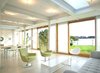 Great room with roller shades pulled Photo 10 of Chesapeake Bay House modern home