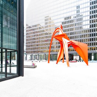 The Chicago Federal Center is another example of the incredible architectural legacy that Mies van der Rohe left the city of Chicago. In his book Chicago: In and Around the Loop, Walking Tours of Architecture and History, Gerard Wolfe refers to the Federal Center as "the ultimate expression of the second Chicago school of architecture." Alexander Calder’s striking ‘Flamingo’ sculpture complements the linear complex. 