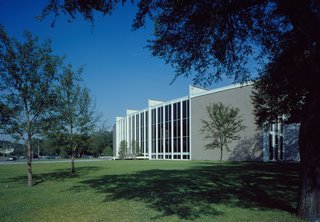 In 1953, Nina J. Cullinan gifted a building addition to Houston's Museum of Fine Arts as a memorial for her parents. Her only stipulation was that it had to be designed by an architect of "outstanding reputation and wide experience." After being selected for the commission, Mies arrived in Houston on a hot summer day and rejected the idea of a standard open museum courtyard by remarking, "But in this climate, you cannot want an open patio."