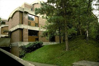 Maisons Jaoul is pair of houses built for André Jaoul and his son Michel in the upscale Paris suburb of Neuilly-sur-Seine. A departure from his white squares, the homes are among Le Corbusier's most important post-war structures and feature unpainted cast-concrete—"béton brut"—together with rugged brickwork.