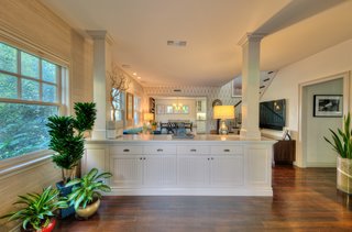Douglas Fir flooring and custom wainscoting and cabinetry have been utilized throughout the main house. 
