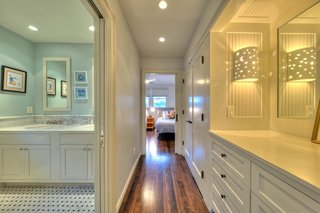 The children's bedroom features ample storage and a private bath.