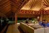 Modern home with Living Room, Chair, Ceiling Lighting, Cement Tile Floor, Sectional, and Coffee Tables. The living/dining area is in a palapa made of natural parota wood which is over 33 feet high. Photo 5 of Casa en el Pacifico