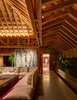 Modern home with Living Room, Ceiling Lighting, Sectional, Cement Tile Floor, and Coffee Tables. The traditional thatched roof has been given a contemporary spin. Photo 6 of Casa en el Pacifico