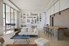 Modern home with Living Room, Shelves, Sofa, Bar, Stools, Coffee Tables, Pendant Lighting, Rug Floor, and Ottomans. The home features five bedrooms and comfortably sleeps ten. Photo 5 of Amizmiz House
