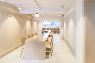 The second floor features two communal tables that can be pushed together to form one long table for special events. 