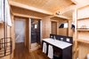 Modern home with Bath Room, Medium Hardwood Floor, Enclosed Shower, Wall Lighting, and Drop In Sink. Each pod is conveniently equipped with a complete bathroom. Photo 7 of Whitepod Eco-Luxury Hotel
