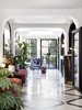 Modern home with Chair, Wall Lighting, Table Lighting, and Lamps. Just a few steps off Paris' Grands Boulevards, Hôtel Bienvenue received a colorful and modern redesign by interior designer Chloé Nègre. Housed in the former Hôtel Villa Fenelon, the renovation of the century-old structure marks the first hotel project for Chloé Nègre, a former protégée of architect and designer India Mahdavi. Hôtel Bienvenue is the latest addition to hotelier Adrien Gloaguen’s portfolio, which also includes Hôtel Panache and Hôtel Paradis. True to its name, the hotel welcomes every guest like a member of the family. Photo 16 of Hôtel Bienvenue