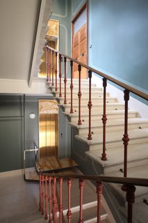 The staircase features milled-eucalyptus wood and was designed by Marcante-Testa and built by Materia Design.