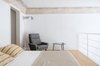 Modern home with Bedroom, Bed, Chair, Wall Lighting, Light Hardwood Floor, and Night Stands. Midcentury modern mixes well within the context of the 16th-century palazzo. Photo 5 of Numeroventi