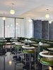 Modern home with Dining Room, Table, Pendant Lighting, Chair, Bench, and Terrazzo Floor. The clean and modern design of the rooms is complemented by built-in plywood and linoleum furnishings—a nod to the designs of Arne Jacobsen and Richard Neutra. Photo 12 of Ace Hotel Chicago