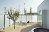 Modern home with Outdoor and Trees. The rooms are vestibule-like spaces with bespoke furniture designed by López and Rivera and crafted by the building's metal fabricator. Photo 15 of Hotel Aire de Bardenas