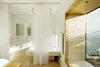 The exaggerated depth of the oversized windowsills are lined with plywood, making them cozy spots to read, watch television, or simply contemplate the landscape. Photo 17 of Hotel Aire de Bardenas modern home