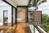Modern home with Outdoor, Wood Patio, Porch, Deck, Trees, and Wire Fences, Wall. Staggered balconies add to the drama of the exterior without competing with the breathtaking view. Photo 20 of Joya Villas