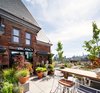 Modern home with Outdoor, Raised Planters, Large Patio, Porch, Deck, Rooftop, and Trees. The Rooftop restaurant and terrace—tucked away in the building’s historic tower. Photo 11 of The Broadview Hotel