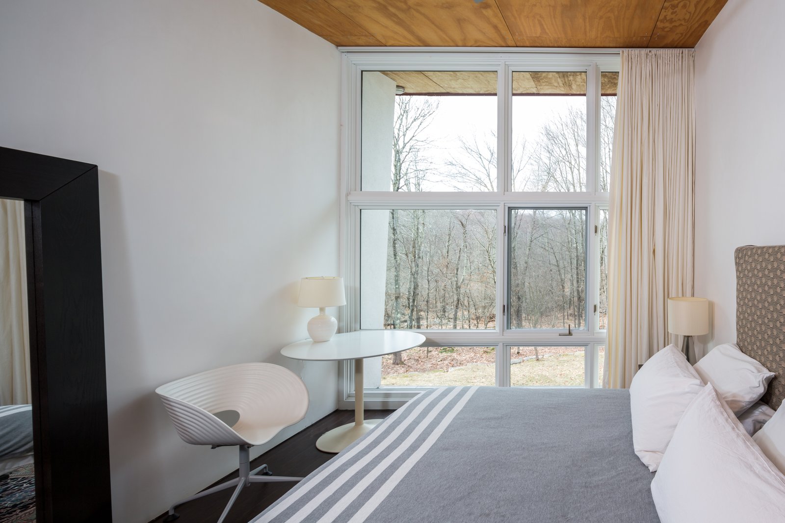 Two bedrooms and a full bath are located on the main floor, with the master bedroom suite on the second level.