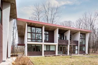 The overhang assists in keeping the home cool in the summer, as it blocks some of the sunlight.

