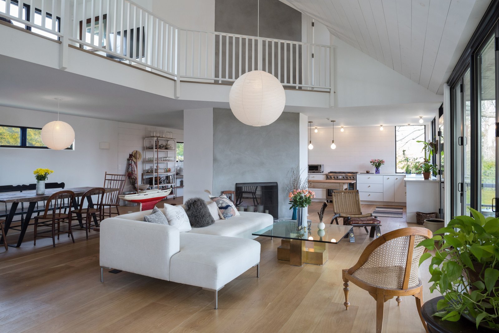 Interiors include an open floor plan, high ceilings, radiant heat, and hardwood floors throughout.
