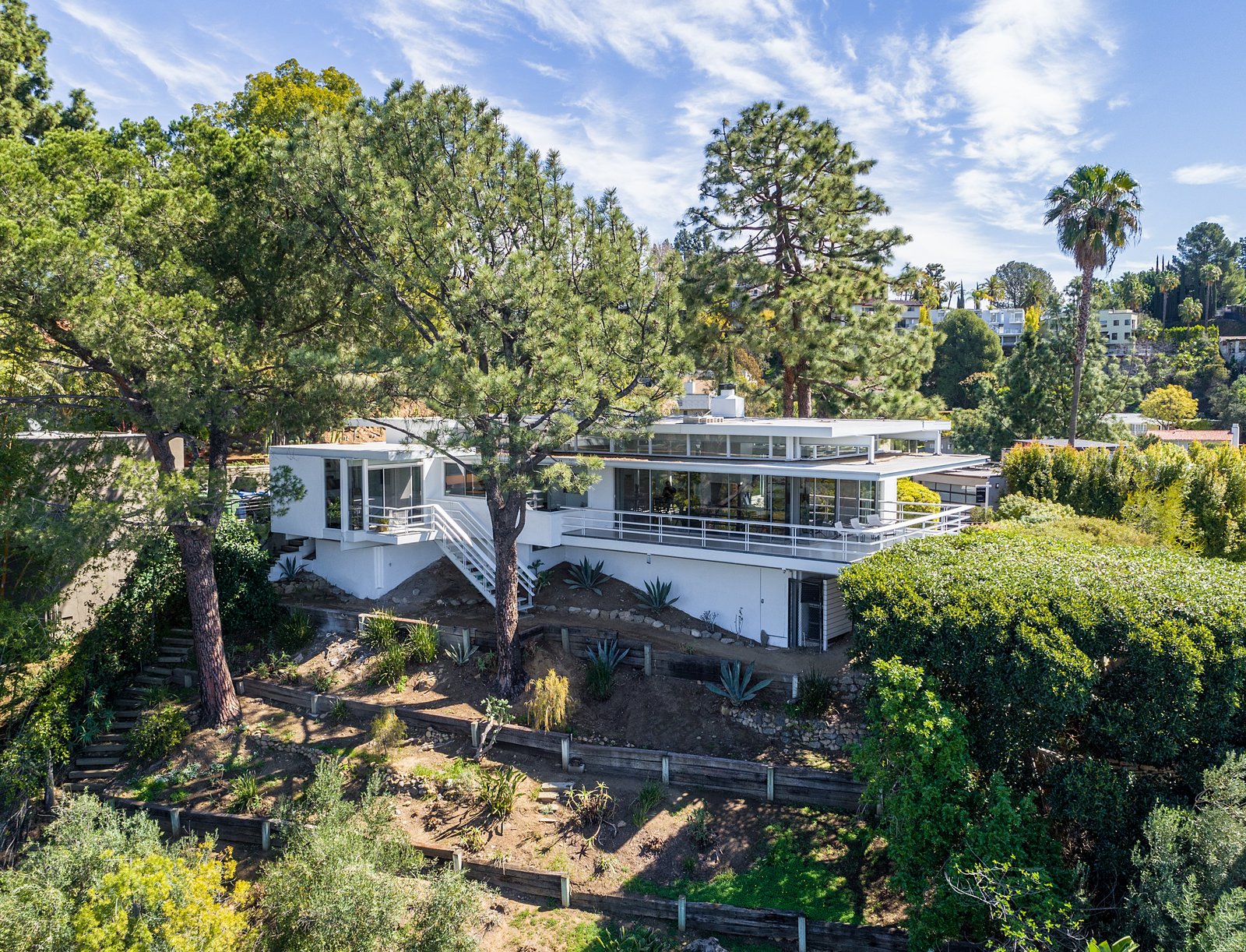 In addition to an expansive hillside garden the home also offers off-street parking for five cars.