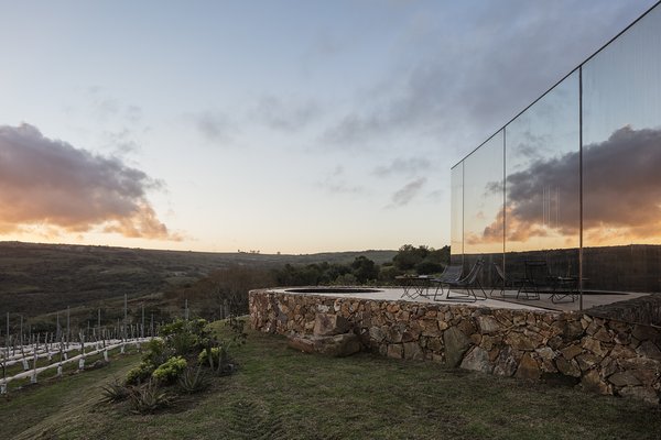 The mirrored structures are inserted into the landscape