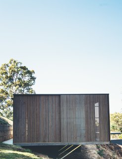 The home is cantilevered out over the hillside site. 