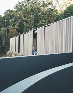 In its simplest form, the new house is designed as an operable glass pavilion that is wrapped in fine hardwood screens, so the owners can control the amount of direct sun coming in. 