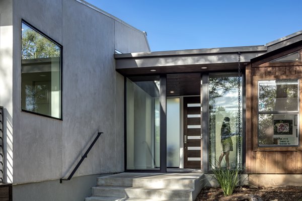 A glass entry connects the addition and offers a clear view of—and direct access to–the natural landscape surrounding the site. 

