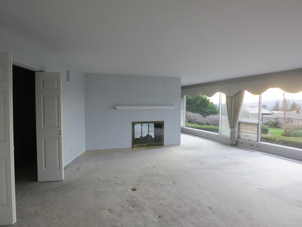Prior to the renovation, the living room felt dark and dated.


