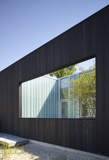 This exterior deck is partially closed and is oriented to take advantage of lakeside vistas. It also allows sunlight into the study and master suite. 

