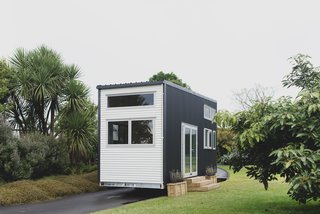 The Buster Tiny House is a customizable model from Build Tiny, a family-owned business that constructs exquisite tiny homes from their own workshop in Katikati, New Zealand. Featuring a lofty living space, lots of natural light, and a surprising amount of storage, this model is sheathed in two-tone corrugated metal and can be ordered either finished or unfinished, giving buyers customization options to meet their own specific needs. The basic shell starts at around $37,885 (NZ $55,600), with a turn-key version is priced at $69,845 (NZ $102,500). 