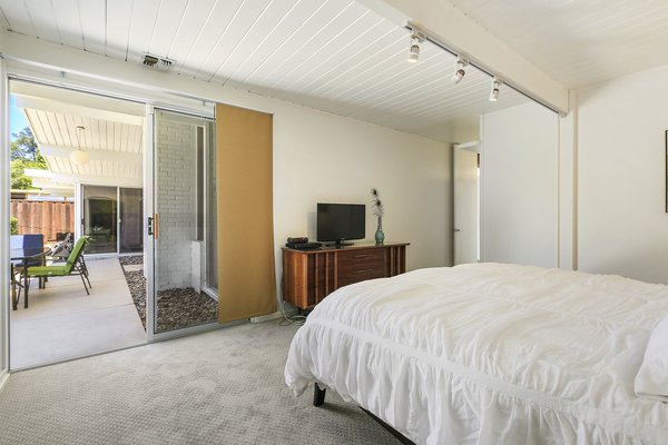 The roomy master suite has an ensuite bathroom and outdoor access.