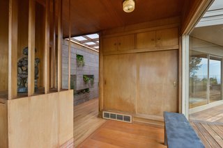 Charming midcentury features like the original wood paneling exist throughout. 