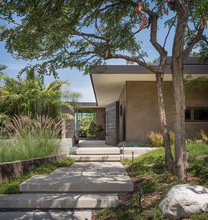 The grand entrance to Woods Cove Retreat welcomes the homeowners and guests.